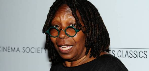 Whoopi Goldberg in round glasses and a black top