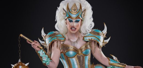 Promotional photograph of Blu Hydrangea holding a mace and chain