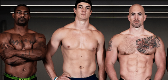 Three bobsledders, standing topless
