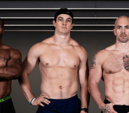 Three bobsledders, standing topless