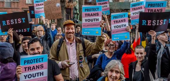 A crowd gathers in support of the trans community