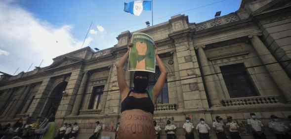People protest against an anti-abortion and anti-LGBT+ bill outside of the Guatemalan Congress in Guatemala City on 15 March 2022