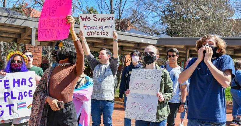 Counter-protestors gather to support trans swimmer Lia Thomas at the NCAA Swimming and Diving Championships