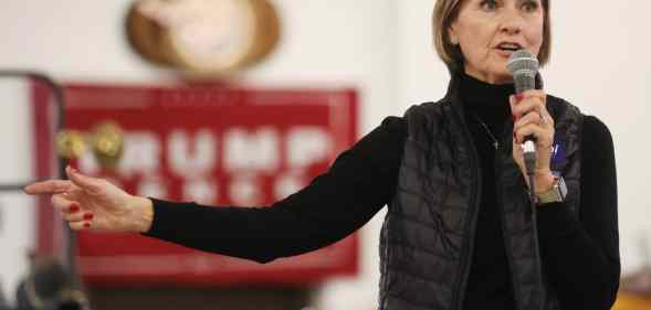 Iowa governor Kim Reynolds speaks on stage