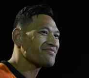 Israel Folau smiles during a match