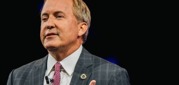 Texas attorney general Ken Paxton speaks to a crowd gathered for CPAC