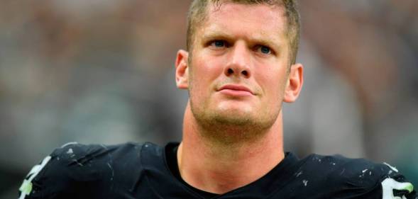 Las Vegas Raiders defensive end Carl Nassib looks on during a game against the Miami Dolphins at Allegiant Stadium