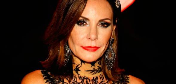 Luann de Lesseps, who appeared on the Real Housewives of New York City, wears a black lacy outfit during a Halloween ball