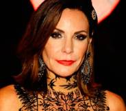 Luann de Lesseps, who appeared on the Real Housewives of New York City, wears a black lacy outfit during a Halloween ball