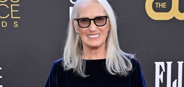 Power of the Dog director Jane Campion attends the Critics Choice Awards wearing a dark blue velvet outfit