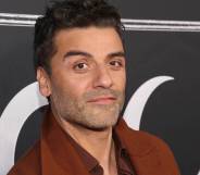 Actor Oscar Isaac attends Marvel's Moon Knight launch event wearing a rust brown jacket