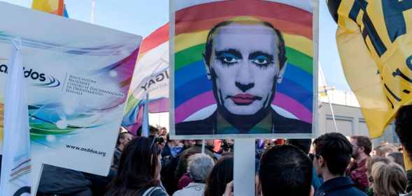 Protester hold a 'gay clown' poster of Russian President Vladimir Putin during the demonstration of LGBT Associations, in front of the Russian Embassy in Rome. The picture has been shared since the invasion of Ukraine