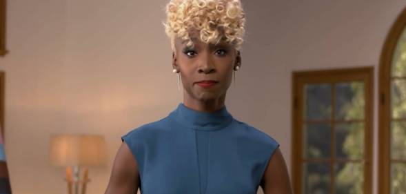 Angelica Ross, a Black trans actor and activist, wears a blue dress