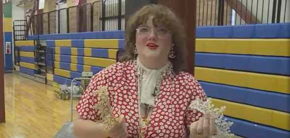 High school student holds prom crowns as she talks about her Queer Prom event to help LGBT+ youth in the local community