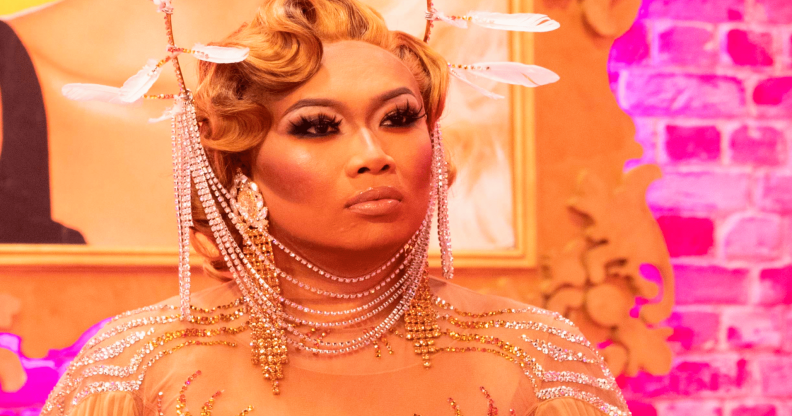 Jujubee in a gold chain headdress