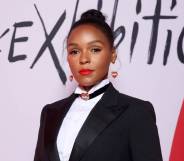 Janelle Monáe wears a black suit jacket, white shirt and collar