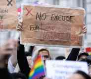 A protester holds a placard saying "No excuse for abuse" during a demonstration against conversion therapy outside UK Cabinet office