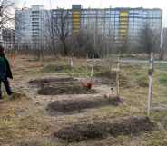 Graves with bodies of civilians next to apartments blocks in the recaptured by the Ukrainian army Bucha city near Kyiv, Ukraine, 04 April 2022.