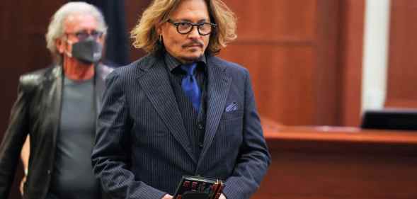 Actor Johnny Depp attends his defamation trial with his ex-wife Amber Heard at the Fairfax County Circuit Courthouse