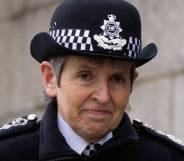 Outgoing Metropolitan Police commissioner Cressida Dick stares at the camera while wearing a black and white police uniform