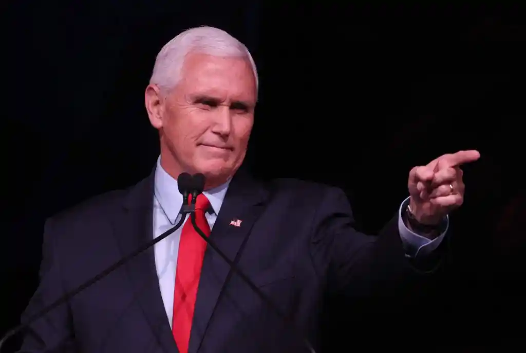Mike Pence in a suit points