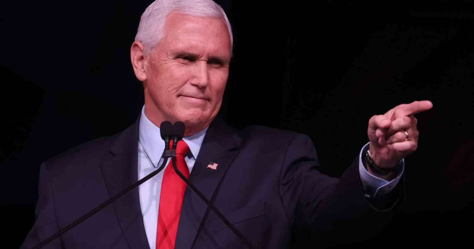 Mike Pence in a suit points