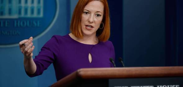 Jen Psaki, the White House press secretary, wears a purple outfit as she speaks to reporters at a briefing