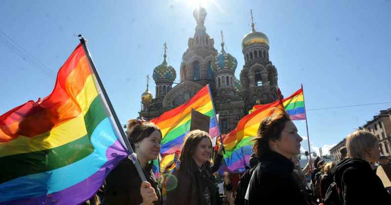Gay rights activists march in Russia's second city of St. Petersburg May 1, 2013.