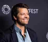 Misha Collins smiles on the red carpet