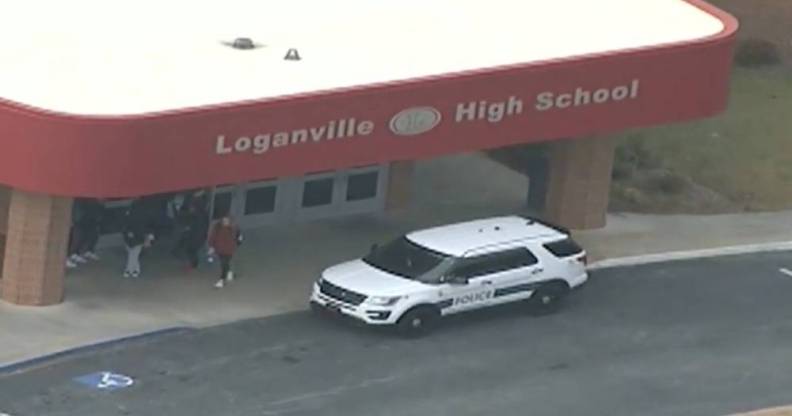 A picture of Loganville High School in Georgia from a distant with a police car outside the school's entrance investigating an alleged homophobic attack against a student