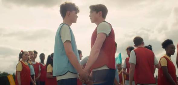 a still image of Heartstopper characters Nick and Charlie on a rugby field