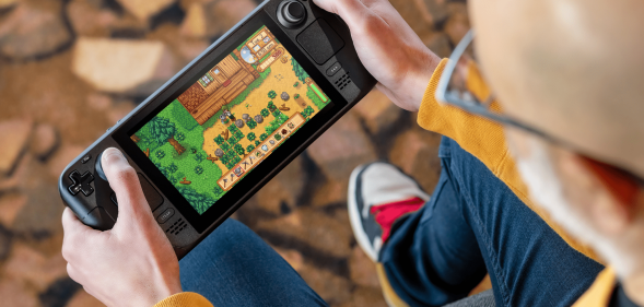 Person playing Steam Deck, a handheld console