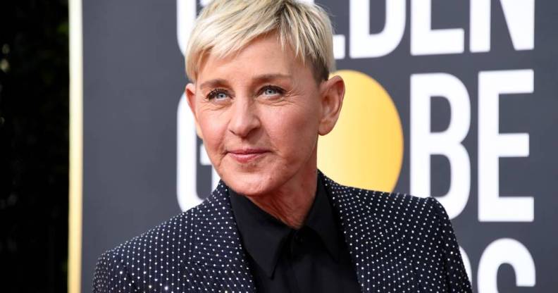 Ellen DeGeneres wears a black shirt, dark jacket which is decorated with rhinestones as she stares off camera