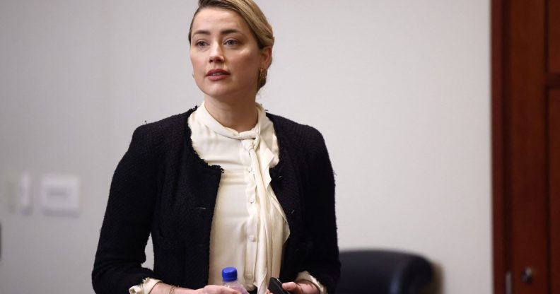 Amber Heard denies assaulting ex-girlfriend and accuses Johnny Depp of 'smear campaign'