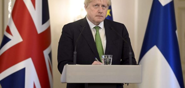 Boris Johnson speaks from a podium