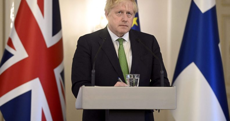 Boris Johnson speaks from a podium