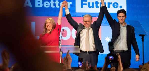Anthony Albanese celebrates his election victory with his partner Jodie Haydon and son Nathan Albanese
