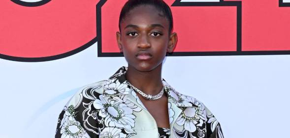 Zaya Wade stares at the camera while wearing a black and white floral patterned outfit