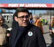 Mayor of Greater Manchester Andy Burnham wears a sticker in support of seafarers