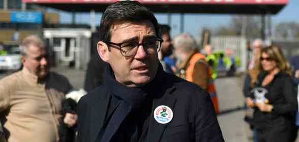 Mayor of Greater Manchester Andy Burnham wears a sticker in support of seafarers