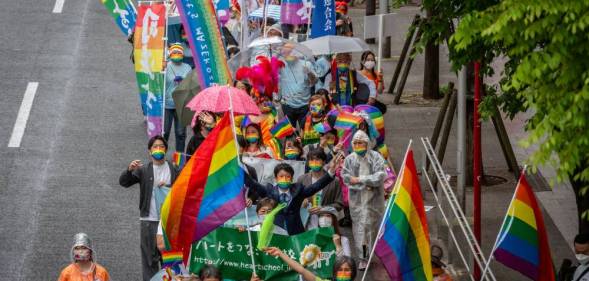 The LGBTQ+ community and allies march in the Tokyo Rainbow Pride parade from the Shibuya and Harajuku areas carrying rainbow flags and signs