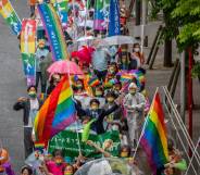 The LGBTQ+ community and allies march in the Tokyo Rainbow Pride parade from the Shibuya and Harajuku areas carrying rainbow flags and signs