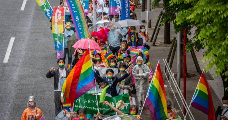 The LGBTQ+ community and allies march in the Tokyo Rainbow Pride parade from the Shibuya and Harajuku areas carrying rainbow flags and signs