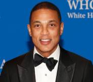Journalist Don Lemon smiles at the camera while wearing a white shirt black bow tie and black suit jacket