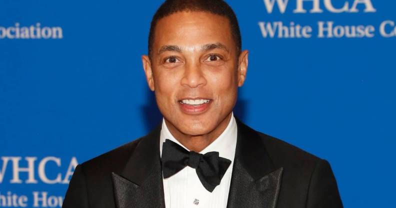 Journalist Don Lemon smiles at the camera while wearing a white shirt black bow tie and black suit jacket