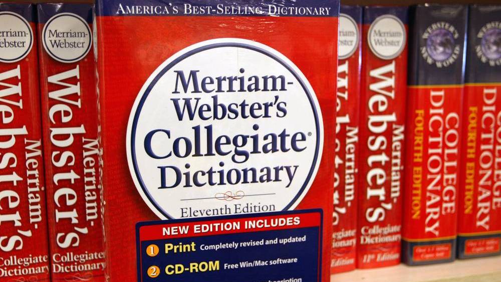A picture of Merriam-Webster dictionary on a shelf