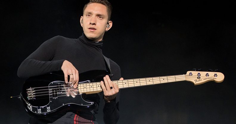 Oliver Sim of The xx performs on his bass guitar