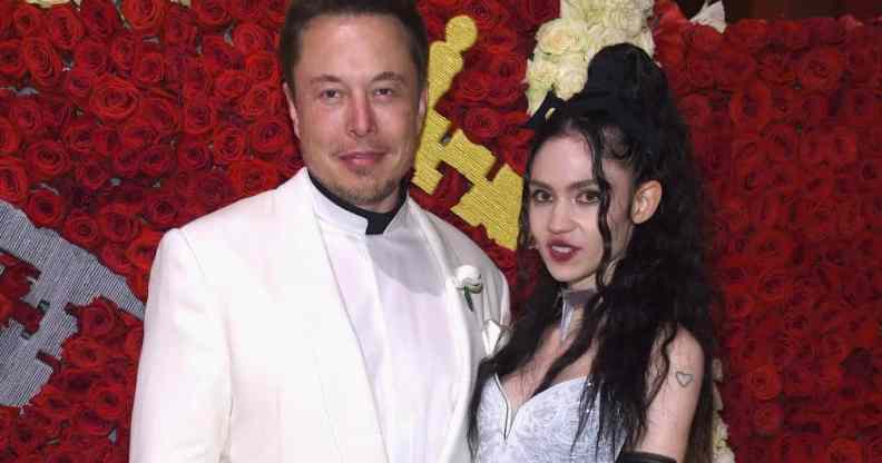 Elon Musk and Grimes pose for the camera as they attend the Met Gala
