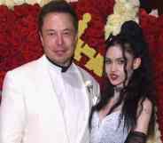 Elon Musk and Grimes pose for the camera as they attend the Met Gala