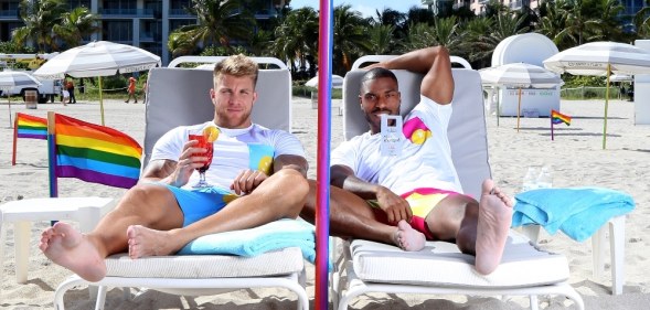 Two men enjoy drinks on Miami Beach